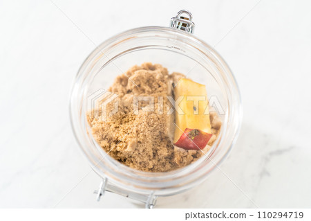 Making light brown sugar soft again with an apple core. Making light brown sugar soft again with an apple core. 110294719