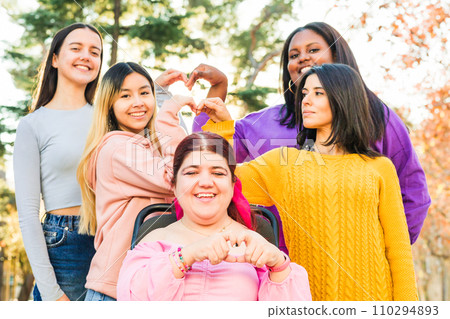Inspire Inclusion international womens day. Diverse group do heart love with hands. Disability  110294893