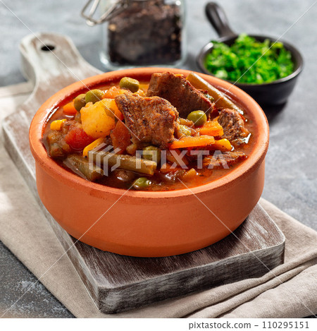 Vegetable beef stew with potato, green beans, carrot, peas and corn, in ceramic bowl, square format Vegetable beef stew with potato, green beans, carrot, peas and corn, in ceramic bowl, square format 110295151