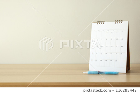 calendar page close up on wood table background with pen and notebook business planning appointment meeting concept 110295442