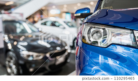 new cars in dealer showroom interior background 110295465