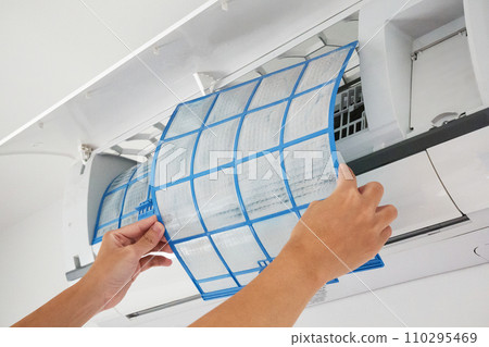 man hand hold air conditioner filter cleaning concept man hand hold air conditioner filter cleaning concept 110295469