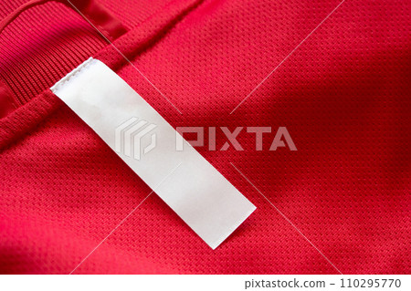 White blank clothes label on red jersey texture background White blank clothes label on red jersey texture background 110295770