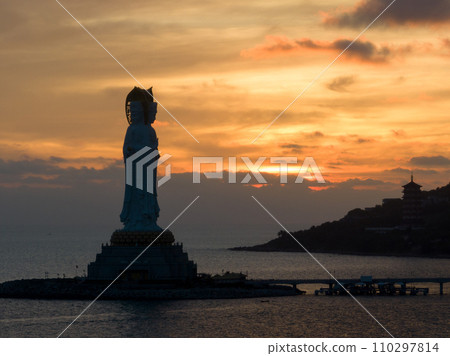 Aerial view of Guanyin statue at seaside in nanshan temple, hainan island , China Aerial view of Guanyin statue at seaside in nanshan temple, hainan island , China 110297814