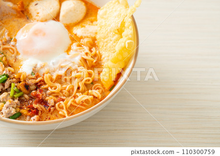 instant noodles with pork and meatballs in spicy soup instant noodles with pork and meatballs in spicy soup 110300759