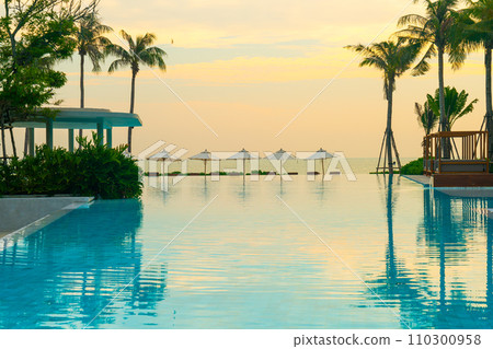 umbrella with bed pool around swimming pool with ocean sea background 110300958