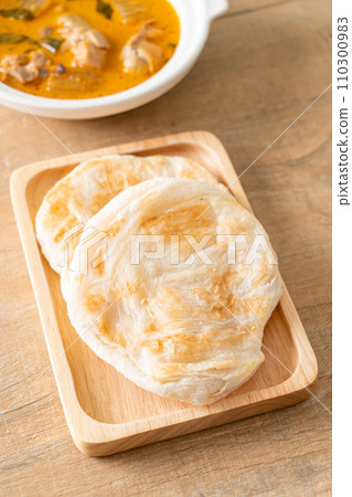 Chicken curry soup with roti Chicken curry soup with roti 110300983