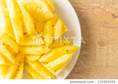 fresh pineapple sliced on plate fresh pineapple sliced on plate 110301016