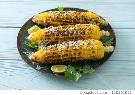 barbecue and grilled corn with cheese and lime barbecue and grilled corn with cheese and lime 110301032