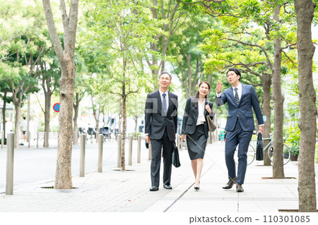 Business people walking man and woman 110301085