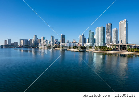 City of Miami, Florida reflected in calm water of Biscayne Bay on sunny morning. 110301135