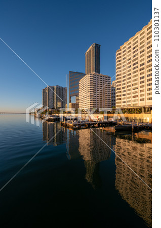 City of Miami, Florida skyline reflected in Biscayne Bay at sunrise. 110301137