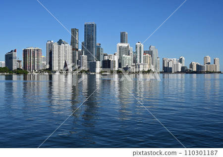City of Miami, Florida skyline reflected in calm water of Biscayne Bay. 110301187