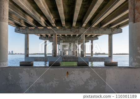 Underside of Rickenbacker Causeway bridge showing structure. 110301189