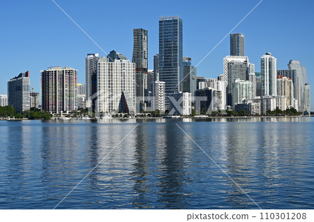 City of Miami, Florida skyline reflected in calm water of Biscayne Bay. 110301208