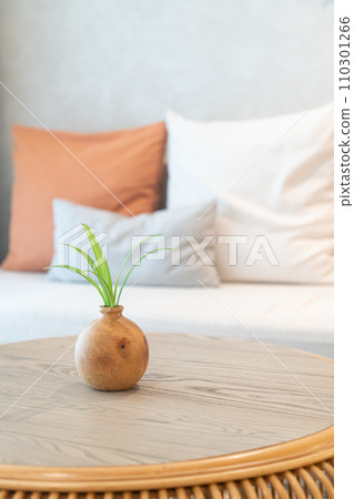 ceramic or porcelain vase with plant decoration on table in living room ceramic or porcelain vase with plant decoration on table in living room 110301266
