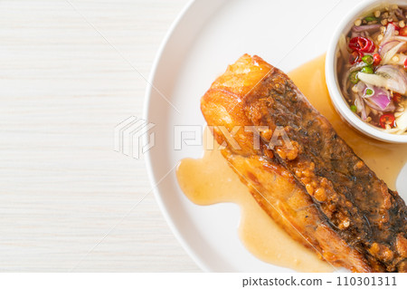 fried snapper fish with fish sauce and spicy salad 110301311