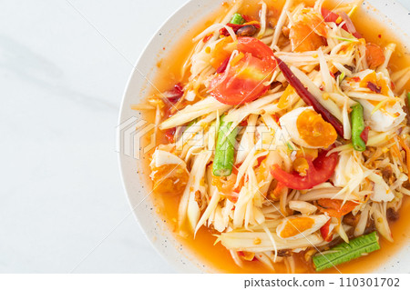 Som Tum - Thai Spicy green papaya salad with salty eggs Som Tum - Thai Spicy green papaya salad with salty eggs 110301702