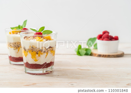 homemade mango and raspberry with yogurt and granola homemade mango and raspberry with yogurt and granola 110301848