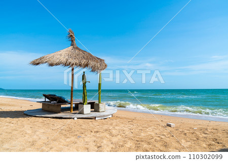 beach chair and umbrella with sea beach background 110302099