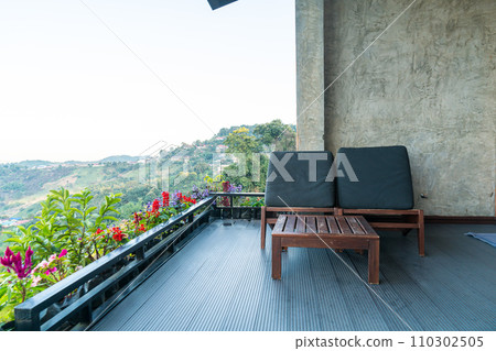 chair on balcony with mountain hill background 110302505