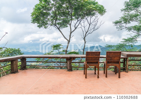 wood bar and chair with mountain hill background 110302688