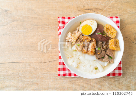 paste of rice flour or boiled Chinese pasta square in clear soup paste of rice flour or boiled Chinese pasta square in clear soup 110302745