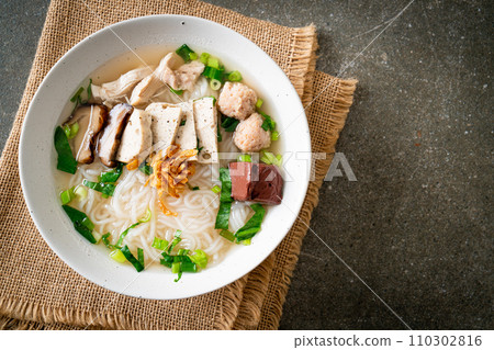 Vietnamese Rice Noodles Soup with Vietnamese Sausage served vegetables and crispy onion Vietnamese Rice Noodles Soup with Vietnamese Sausage served vegetables and crispy onion 110302816