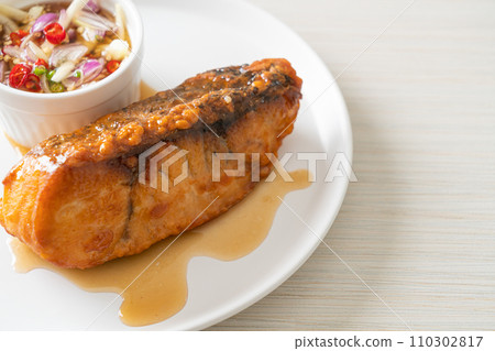 fried snapper fish with fish sauce and spicy salad fried snapper fish with fish sauce and spicy salad 110302817