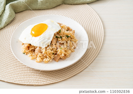 fried rice with pork and fried egg in Japanese style fried rice with pork and fried egg in Japanese style 110302836