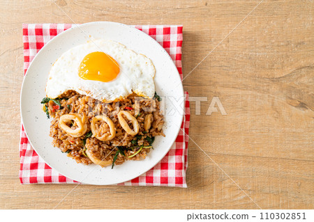 fried rice with squid and basil topped fried egg in Thai style 110302851