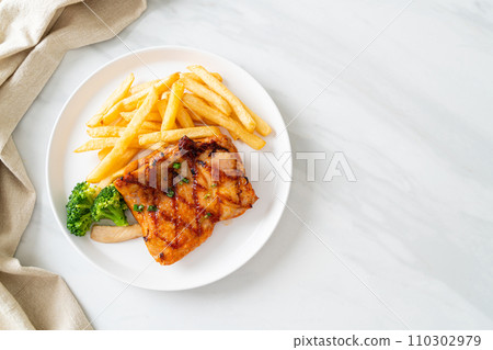 grilled chicken steak with potato chips or french fries 110302979