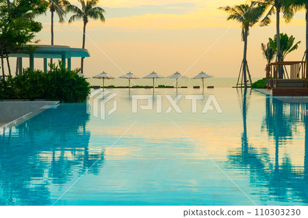 umbrella with bed pool around swimming pool with ocean sea background 110303230