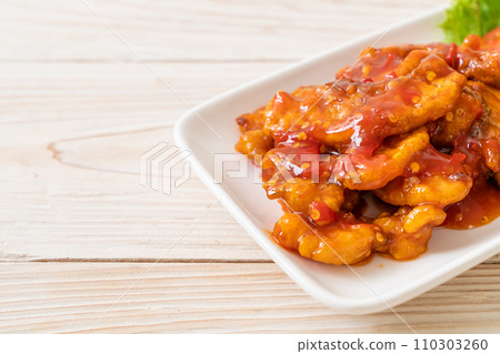 Fried fish topped with 3 flavors chili sauce Fried fish topped with 3 flavors chili sauce 110303260