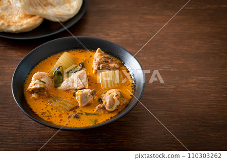 Chicken curry soup with roti Chicken curry soup with roti 110303262