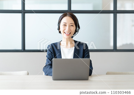 A woman with a headset A woman with a headset 110303466