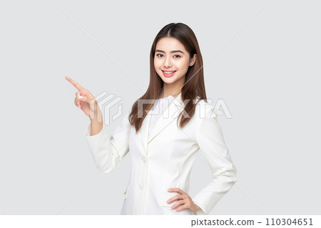 A woman smiling with a finger 110304651