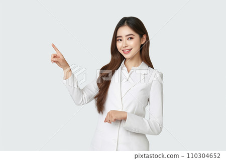 A woman smiling with a finger A woman smiling with a finger 110304652