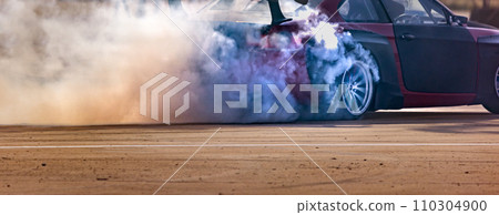 Drift car burning tires on speed track. Drift car burning tires on speed track. 110304900