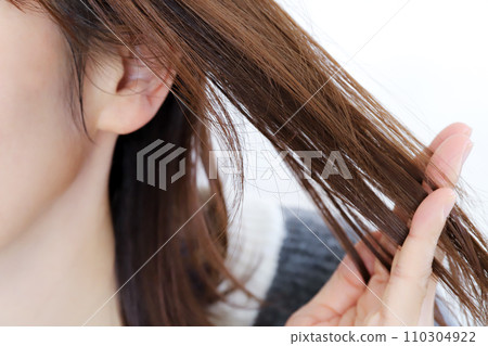Woman touching her hair Hair care image 110304922