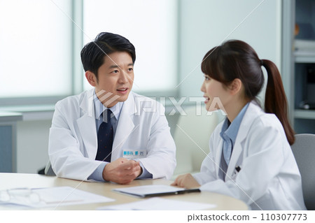 Male doctor and female nurse having a meeting: AI-generated image Male doctor and female nurse having a meeting: AI-generated image 110307773