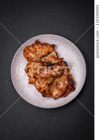 Delicious fresh crispy chicken grilled with salt, spices and herbs Delicious fresh crispy chicken grilled with salt, spices and herbs 110309995