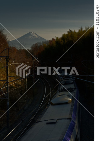 The E353 series Azusa down express train runs with Mt. Fuji in the background. The E353 series Azusa down express train runs with Mt. Fuji in the background. 110310247