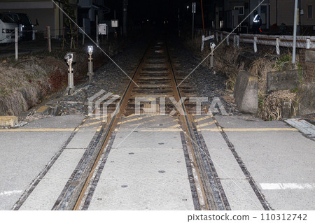 local train tracks at night 110312742