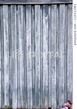 The background is made of green wooden boards. Wooden fence. Old boards. The background is made of green wooden boards. Wooden fence. Old boards. 110312961