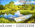 The beautiful landscape ofmall wooden rowing boat on a calm lake. 110313308