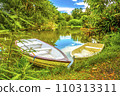 The beautiful landscape ofmall wooden rowing boat on a calm lake. 110313311