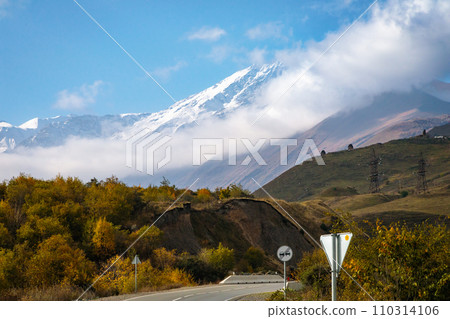 Winter mountain landscape with snow-capped peak Winter mountain landscape with snow-capped peak 110314106