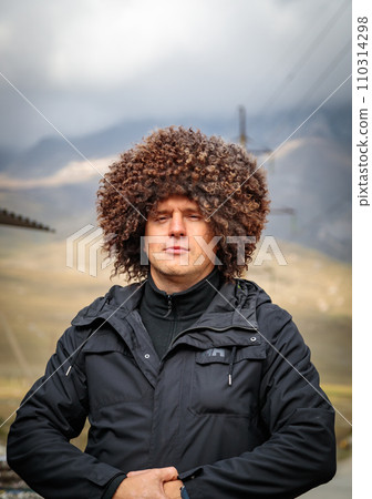 A man in a fur Ossetian hat A man in a fur Ossetian hat 110314298