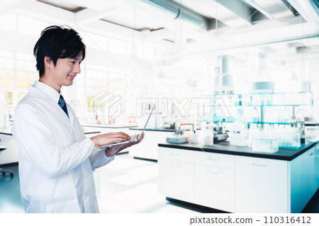 young man working in a research institute 110316412